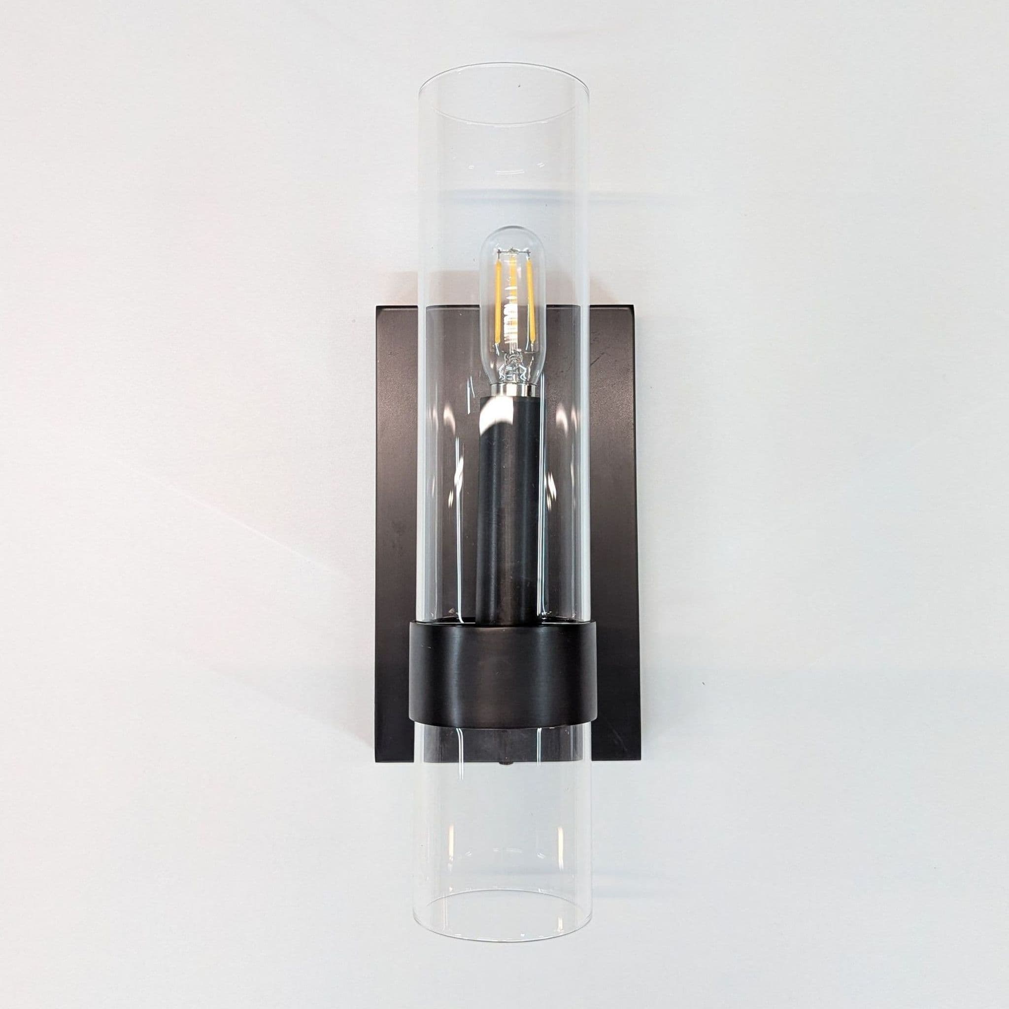 Sleek Modern Wall Sconce with Clear Glass Cylindrical Shade - Image 1