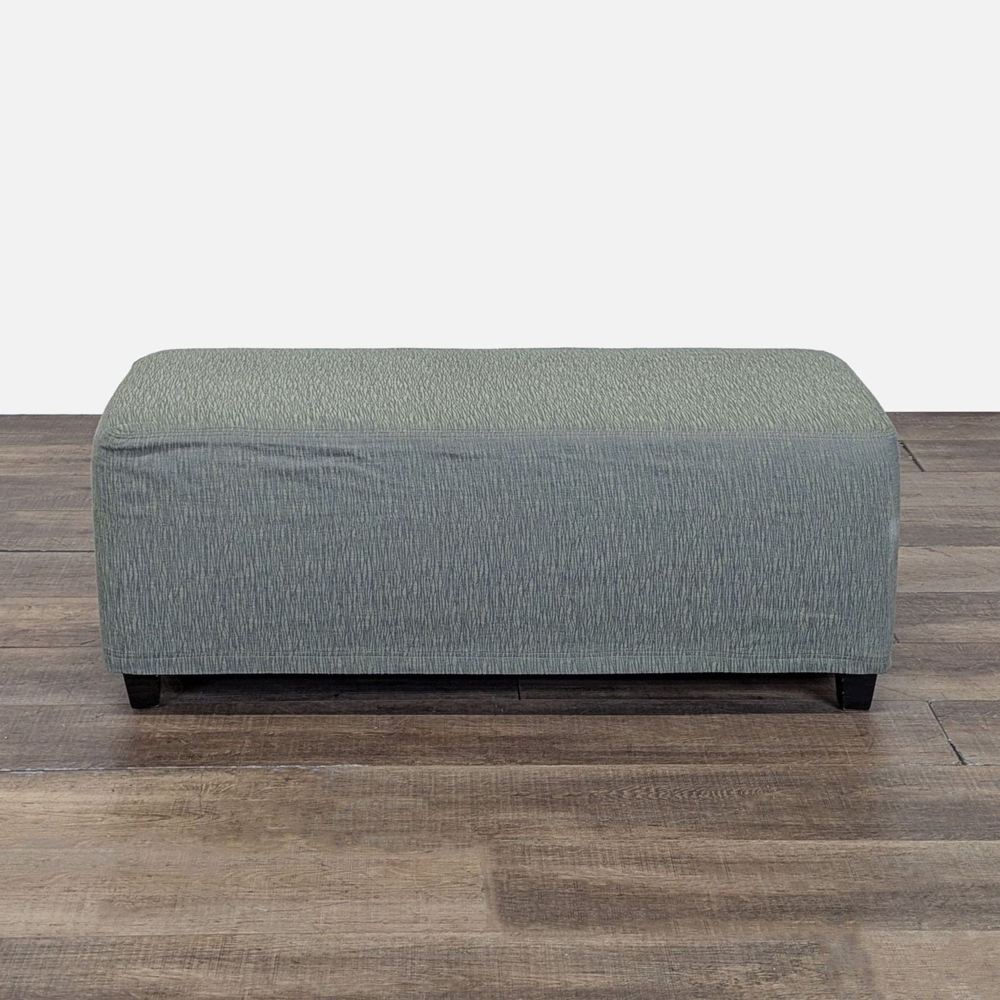 Slip Covered Ottoman on Wood Feet - Image 1