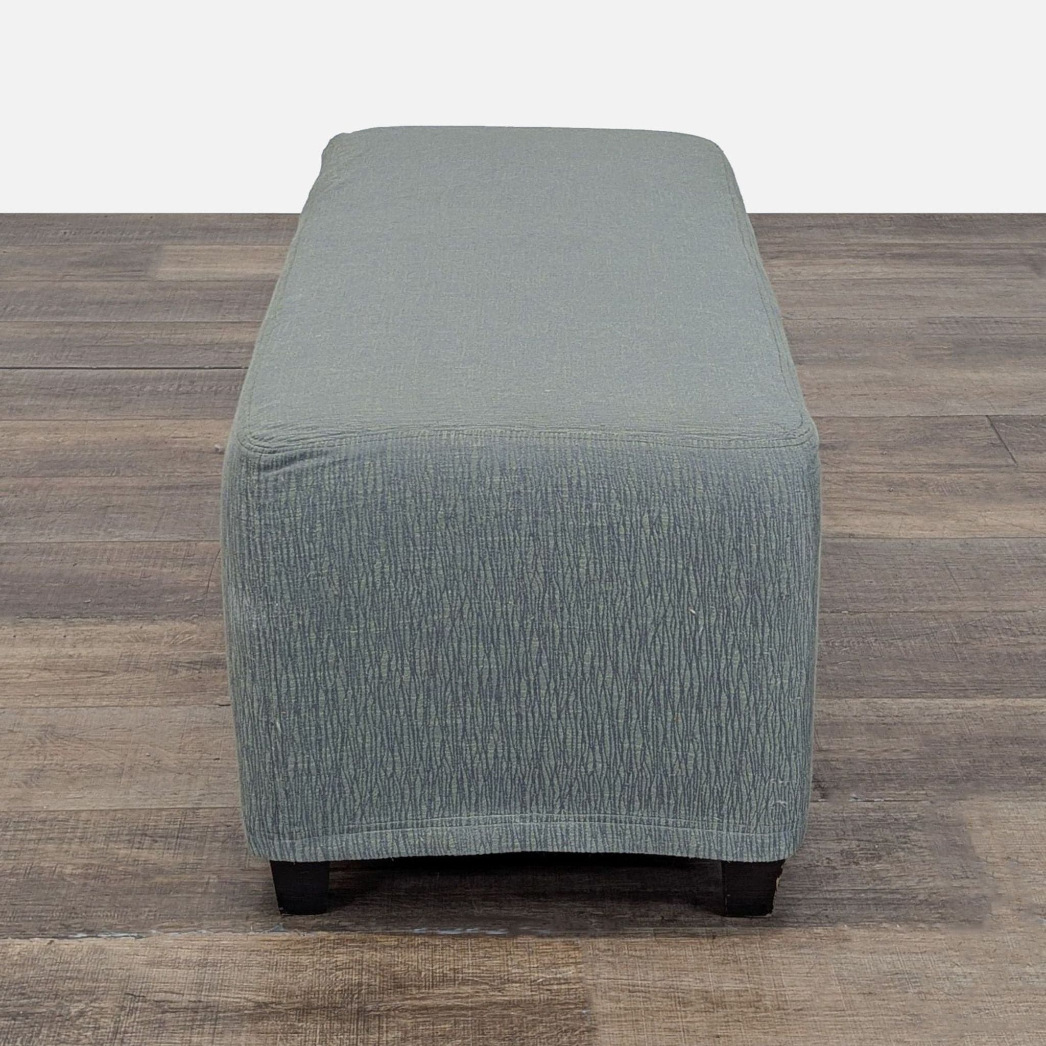 Slip Covered Ottoman on Wood Feet - Thumbnail 3