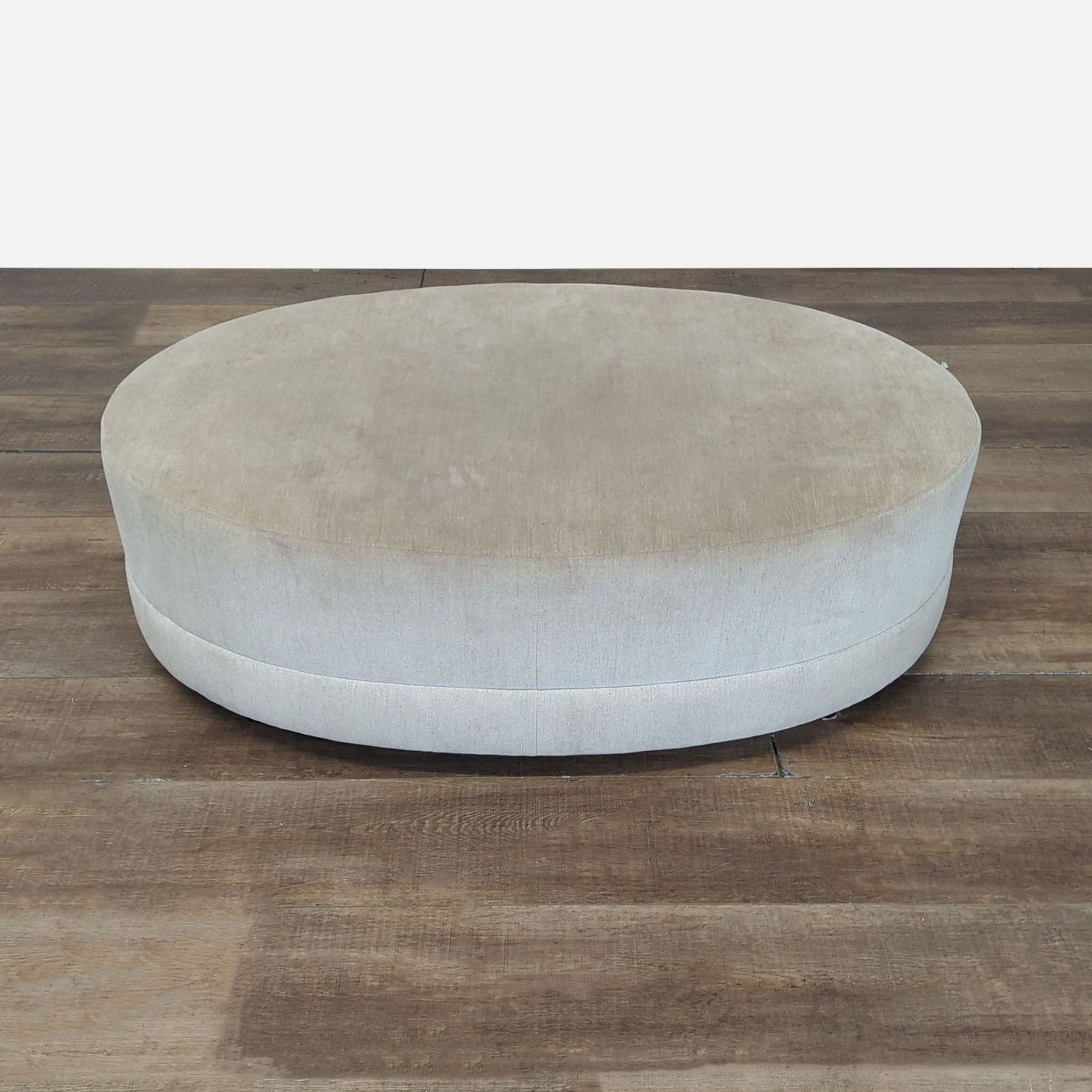 Oval Fabric Covered Ottoman - Image 1