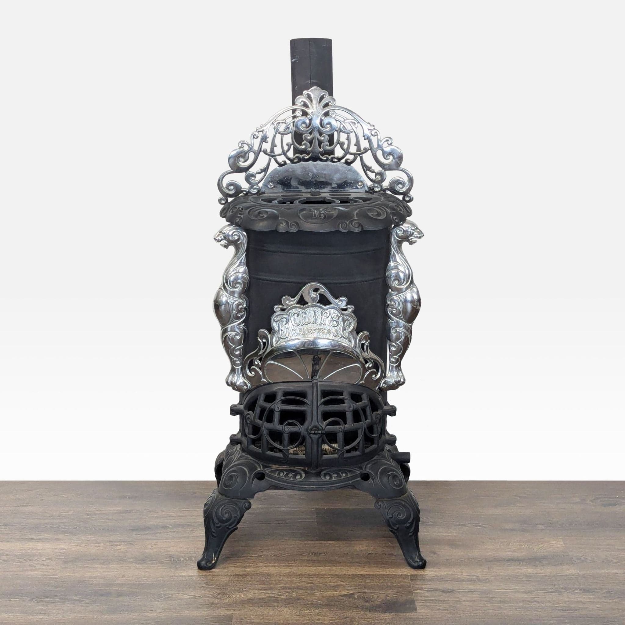 Vintage Iron Parlor Stove with Ornate Details - Image 1