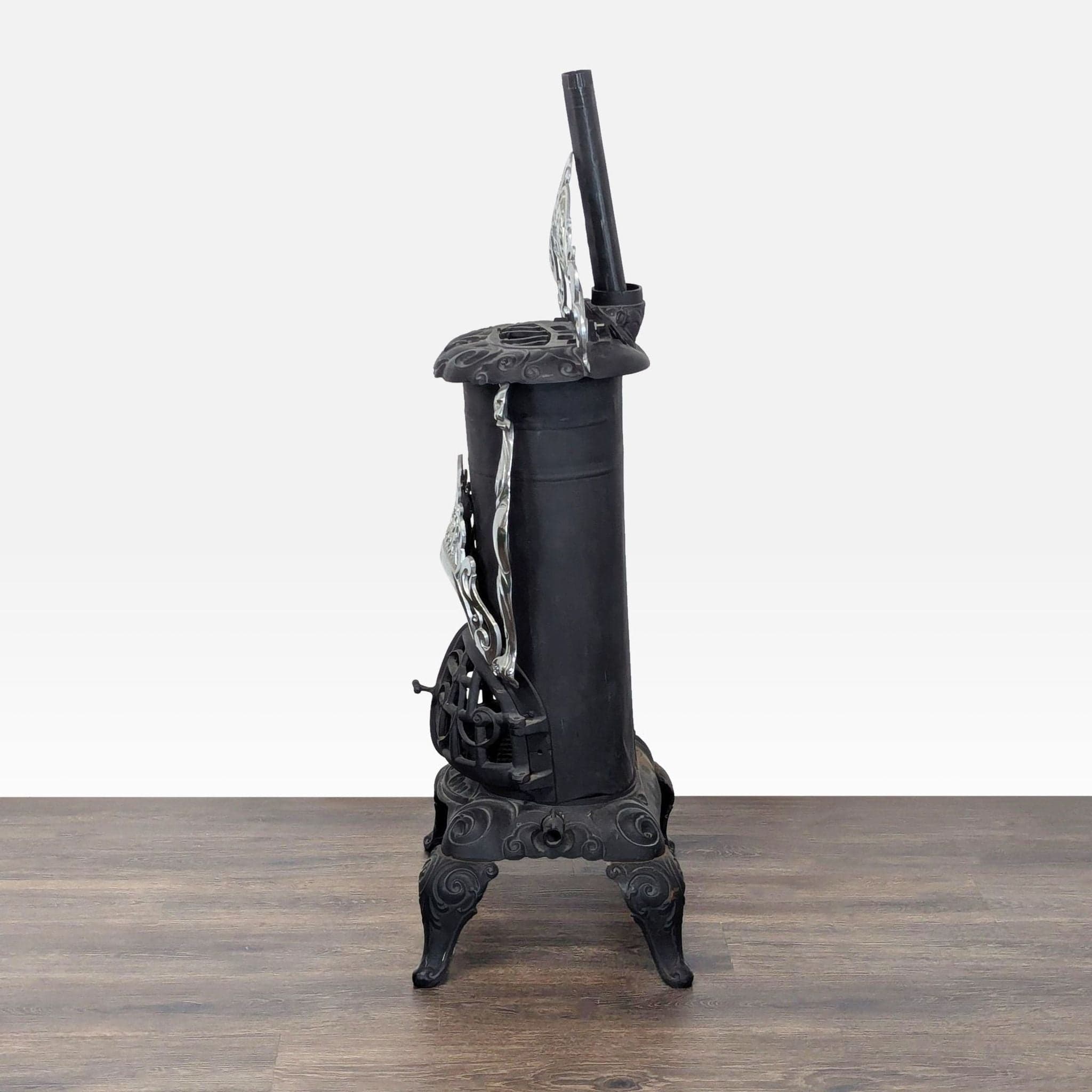 Vintage Iron Parlor Stove with Ornate Details - Thumbnail 3