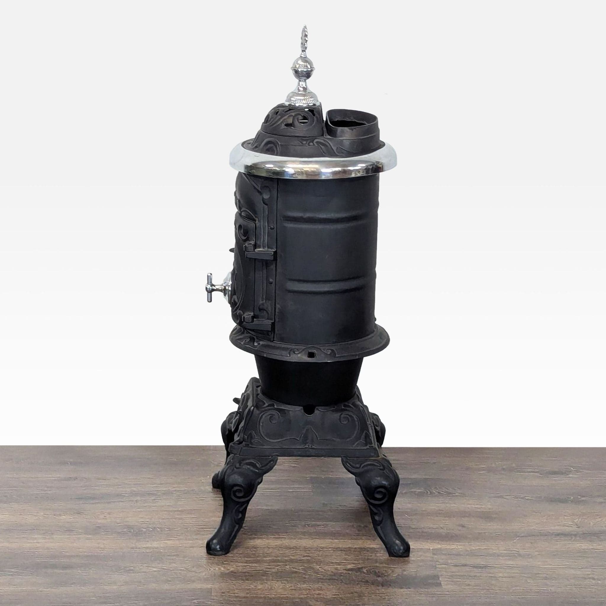 Antique Iron Parlor Stove with Decorative Silver Accents - Thumbnail 8
