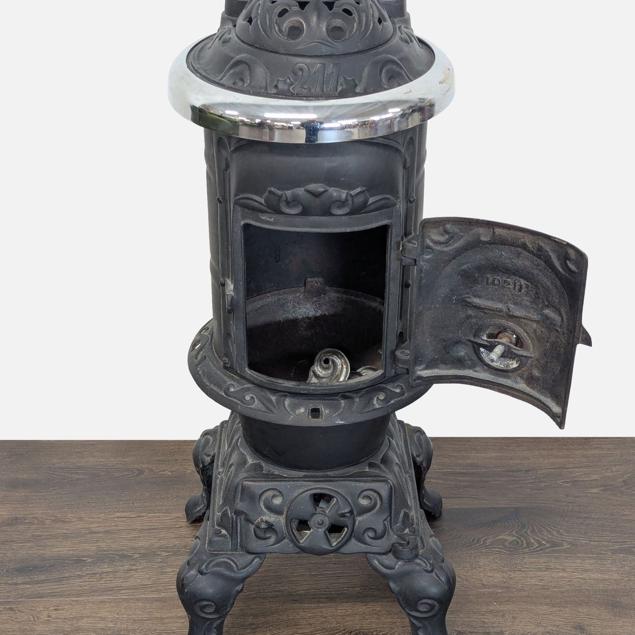 Antique Iron Parlor Stove with Decorative Silver Accents - Thumbnail 2