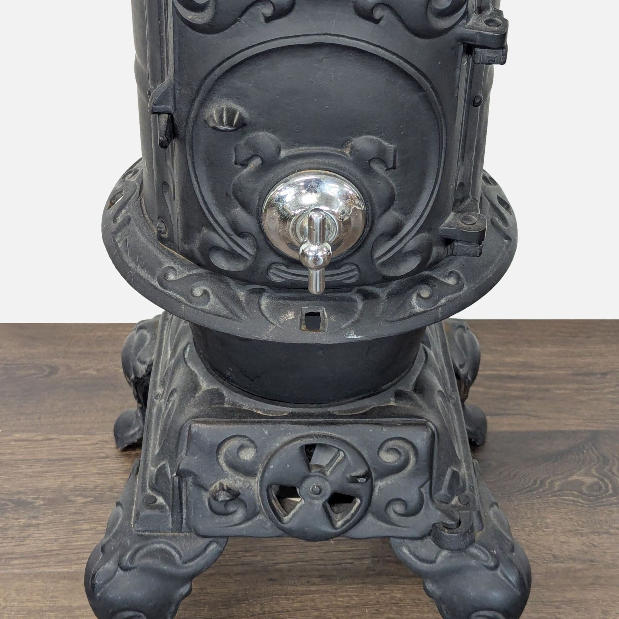 Antique Iron Parlor Stove with Decorative Silver Accents - Thumbnail 3