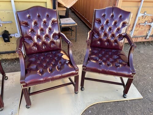 Pair of Queen Anne Mahogany Wing Oxblood Faux Leather Rolling Chairs