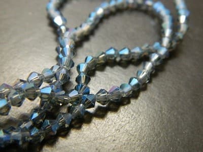 3MM Marine Blue Rainbow Plated Faceted Bicone Glass Beads- Blue Rainbow Finish - Image 1