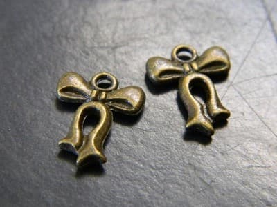 15MM Bronze Bow Ribbon Knot Charm Pendants - Tied Ribbon Bow Knot in Bronze - Image 1