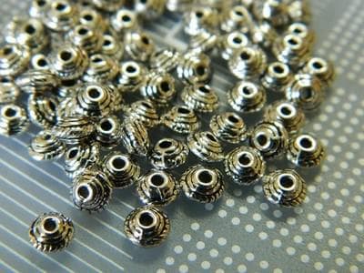 Silver Tibetan Spacer Beads: Flat Donut Design (5mm Diameter) 50 beads - Thumbnail 2