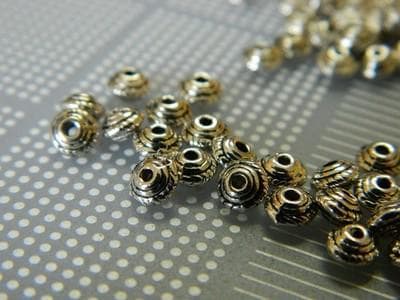 Silver Tibetan Spacer Beads: Flat Donut Design (5mm Diameter) 50 beads - Thumbnail 3