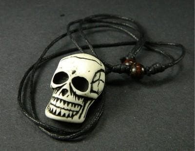 Tribal Yak Bone Skull Pendant: Black and White Resin Charm - Image 1