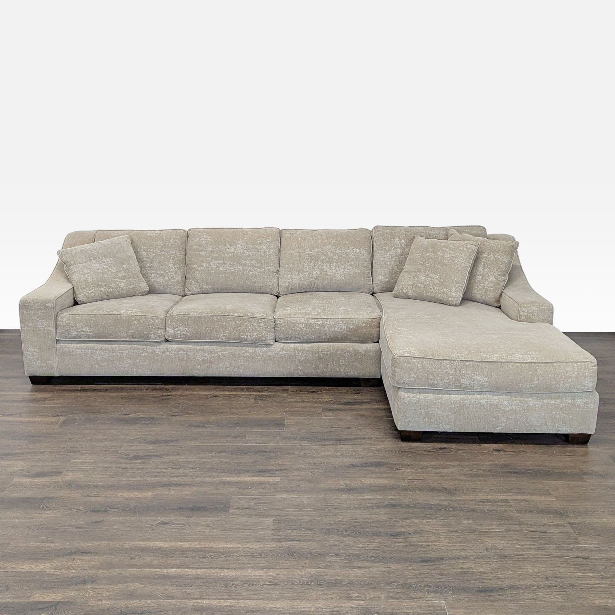 Modern Beige Sectional Sofa with Chaise and Throw Pillows - Image 1