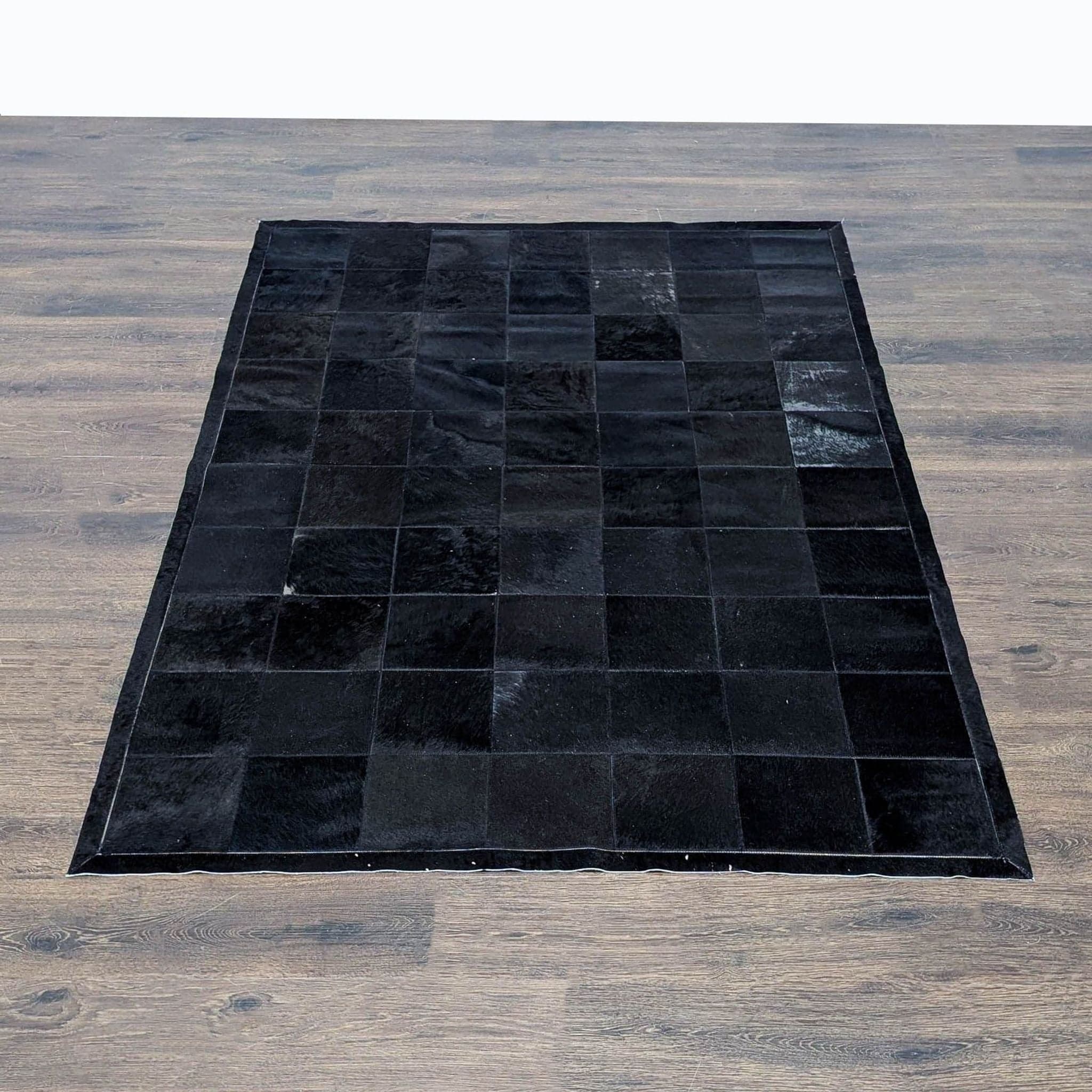 Restoration Hardware 5’ x 7’ Black Patchwork Cowhide Rug - Image 1