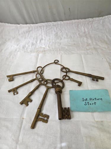 Lot of 7 Vintage mixed size Brass Skeleton Keys on Ring - Image 1