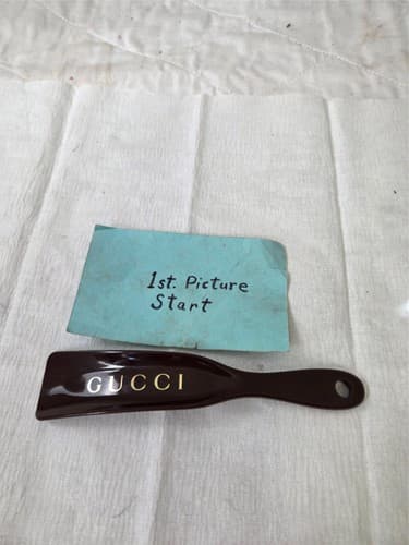 Gucci Black Heavy Plastic Shoehorn with Gold Logo - Image 1