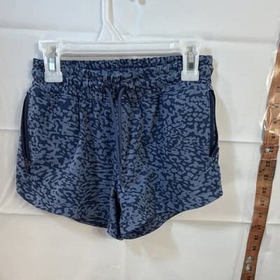 Athleta Girl Blue Animal Print Athletic Shorts M/8-10 Zip Pocket Lightweight - Image 1