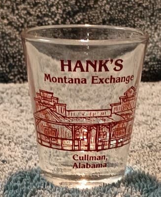 Hank's Montana Exchange Cullman Alabama Clear Shot Glass Painted Barware Novelty - Image 1