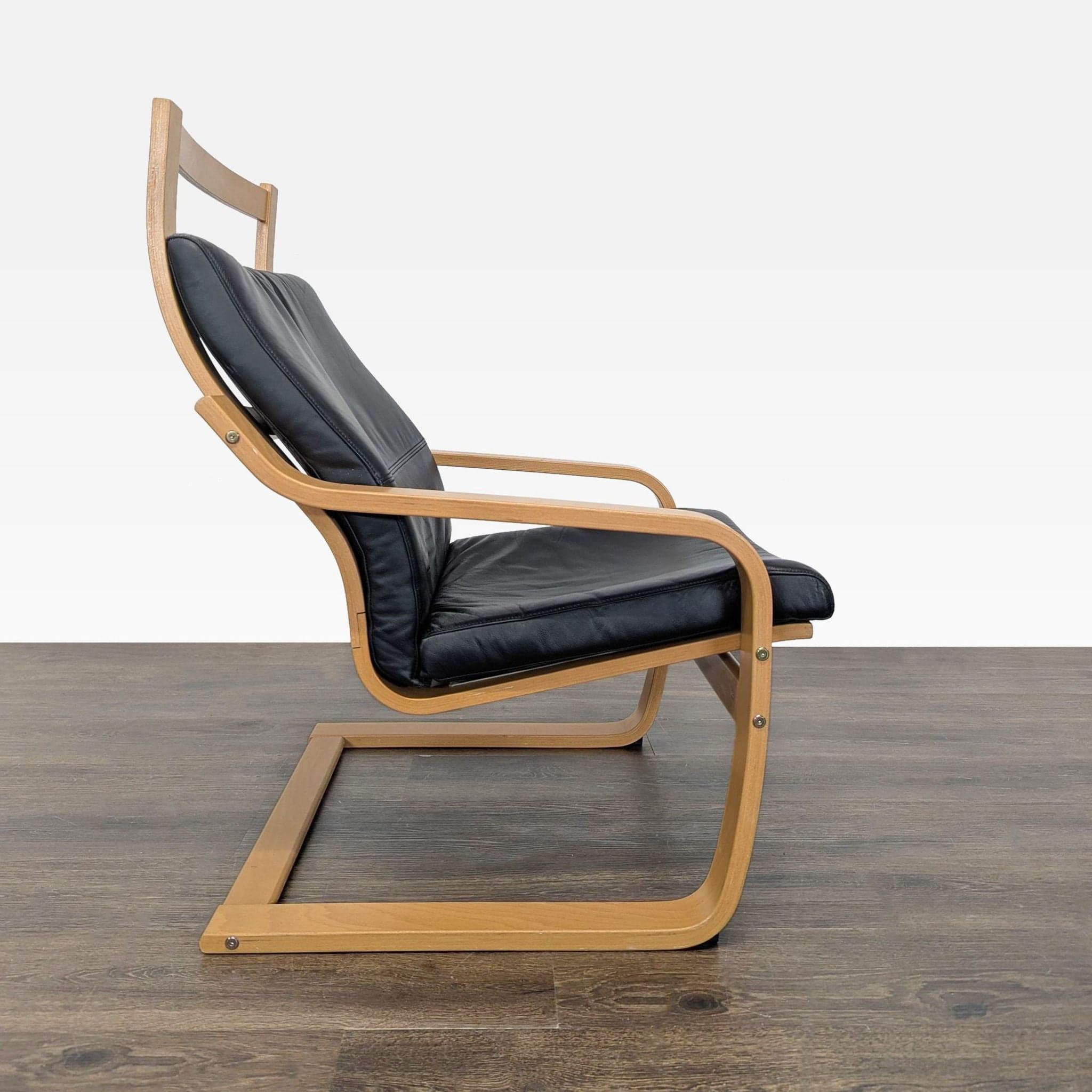 Modern Lounge Chair with Wooden Frame and Black Leather Cushion - Thumbnail 4
