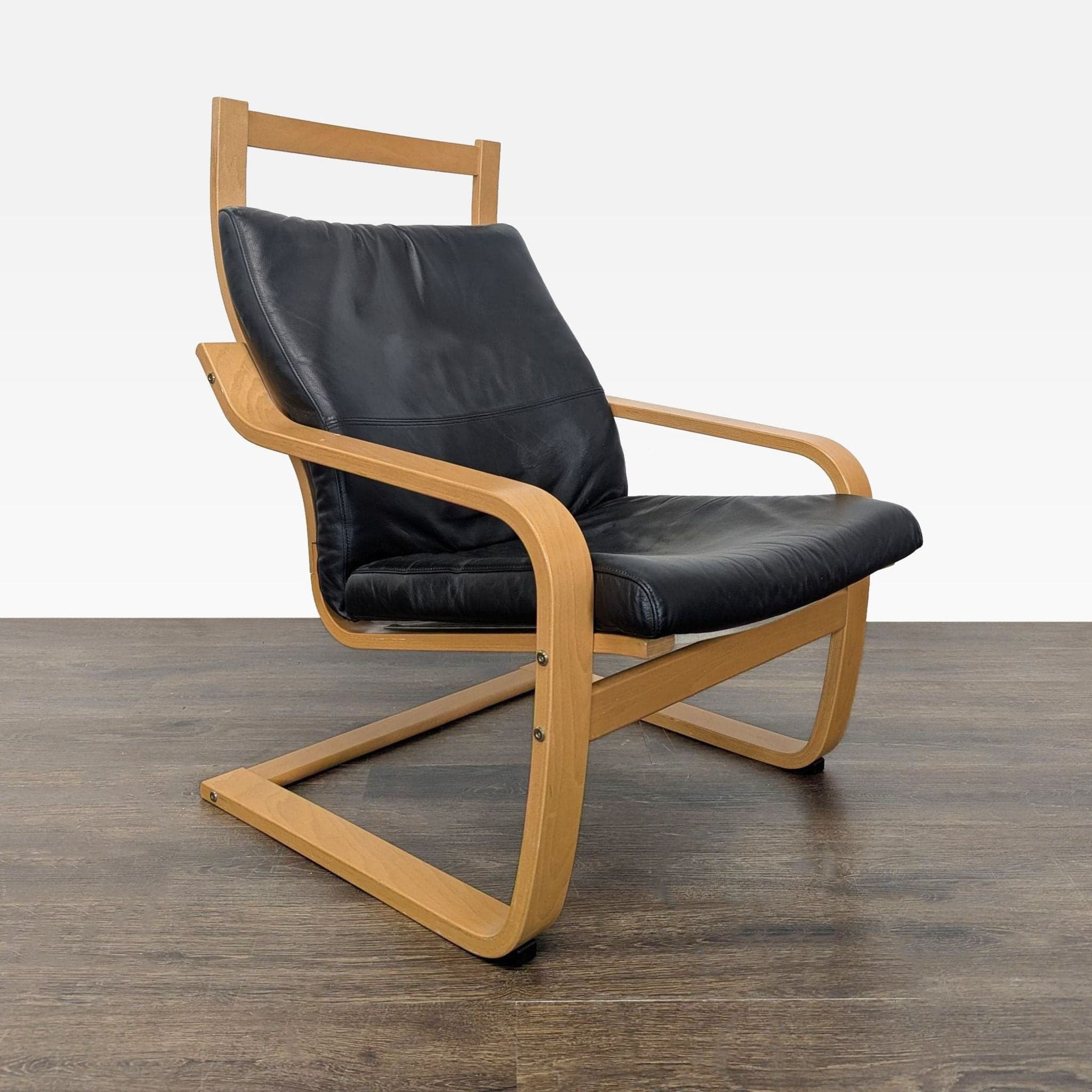 Modern Lounge Chair with Wooden Frame and Black Leather Cushion - Image 1