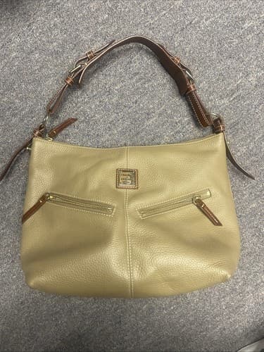 Dooney and Bourke shoulder bag. Tan Pebble Leather With Dark Leather Straps. - Image 1
