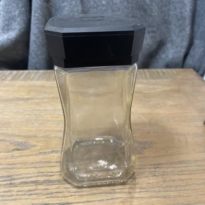 Set Of Two Clear Glass jars with Black Plastic lid On One 7.25” Height - Image 1