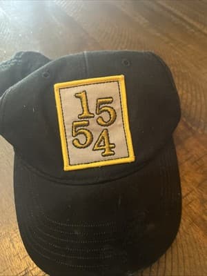 1554 Black Baseball Cap with Embroidered Patch From Makers Of Fat Tire - Image 1