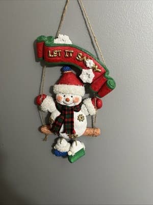 Let It Snow Snowma On A Swing With Dangling Legs Decor - Image 1
