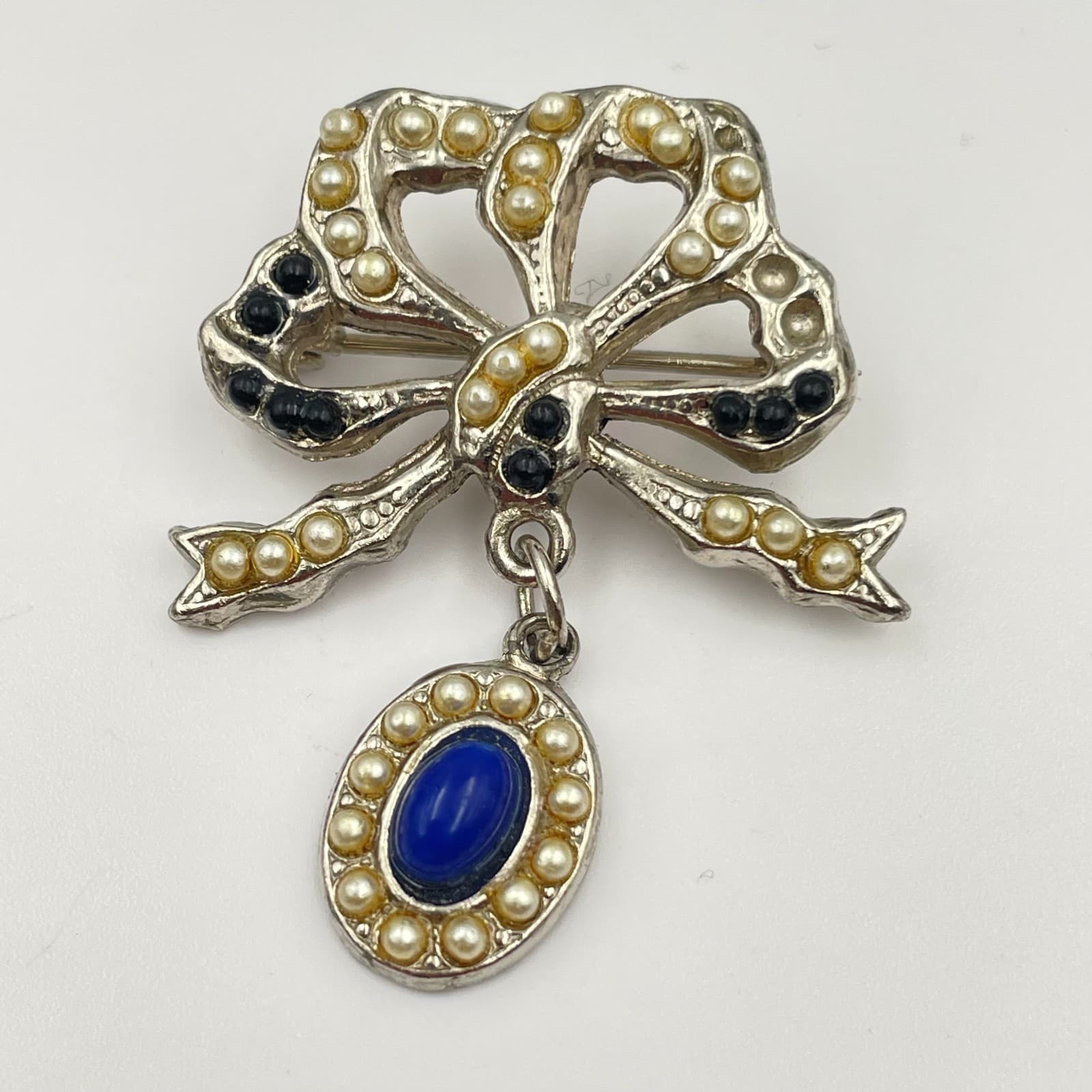 Vintage 90s Silver Tone Faux Pearl Blue Cabochon Dangle Bow Brooch Pin Jewelry - Image 1