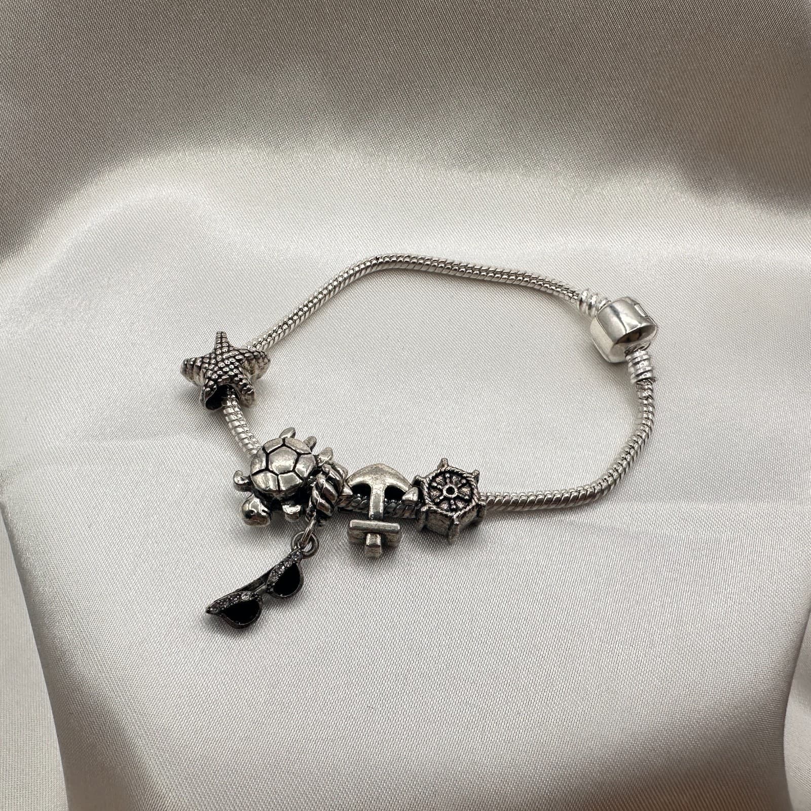 Vintage 80s Beach Charm Bracelet Silver Tone Starfish Turtle Ship Wheel Jewelry - Image 1