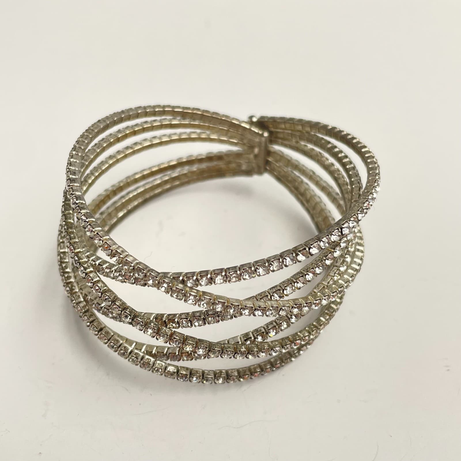 Vintage 90s Silver Tone Glass Rhinestone Multi Row Crossover Bangle Bracelet - Image 1
