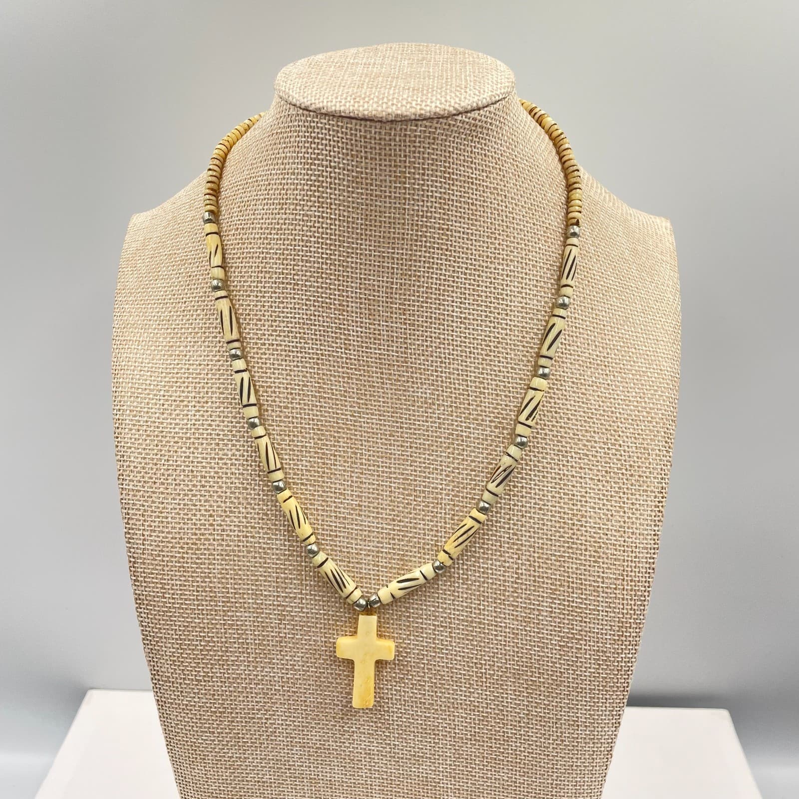 Religious Silver-Tone Beige Batik Beaded Carved Cross Pendant Necklace - Image 1