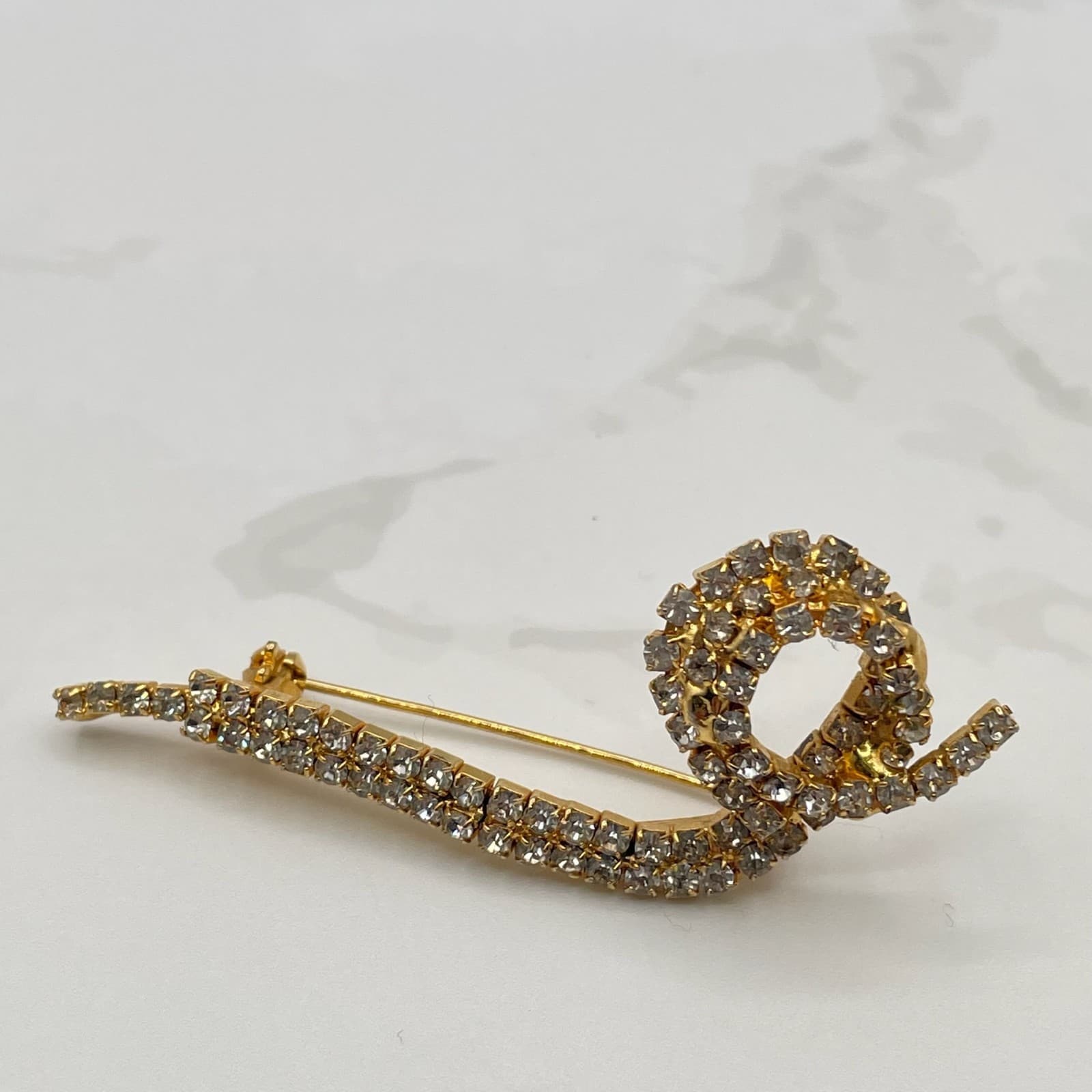 Vintage Gold Tone Brooch Clear Rhinestone Pave Abstract Scroll Snake Design Pin - Image 1