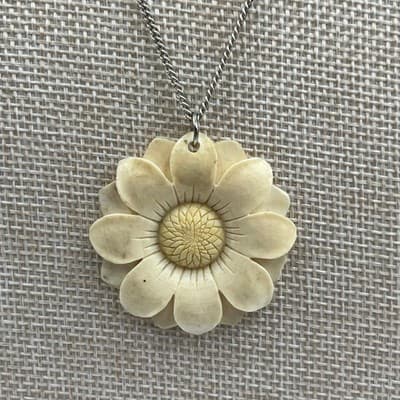 Vintage Carved Flower Pendant Necklace Cream Floral Medallion Silver Tone Chain - Image 1