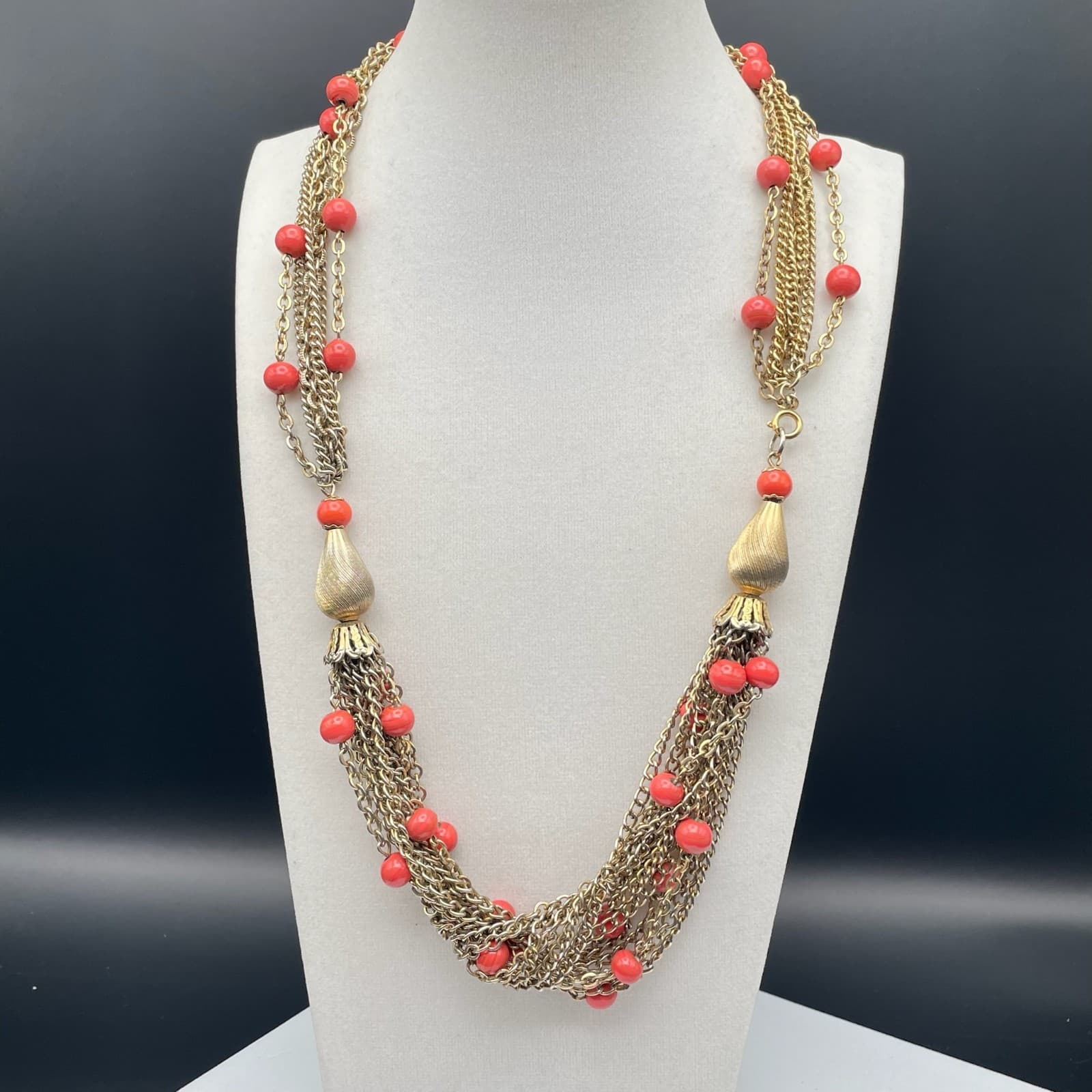 Vintage Multi-strand gold-tone chain necklace with red beads and tassel accents - Image 1