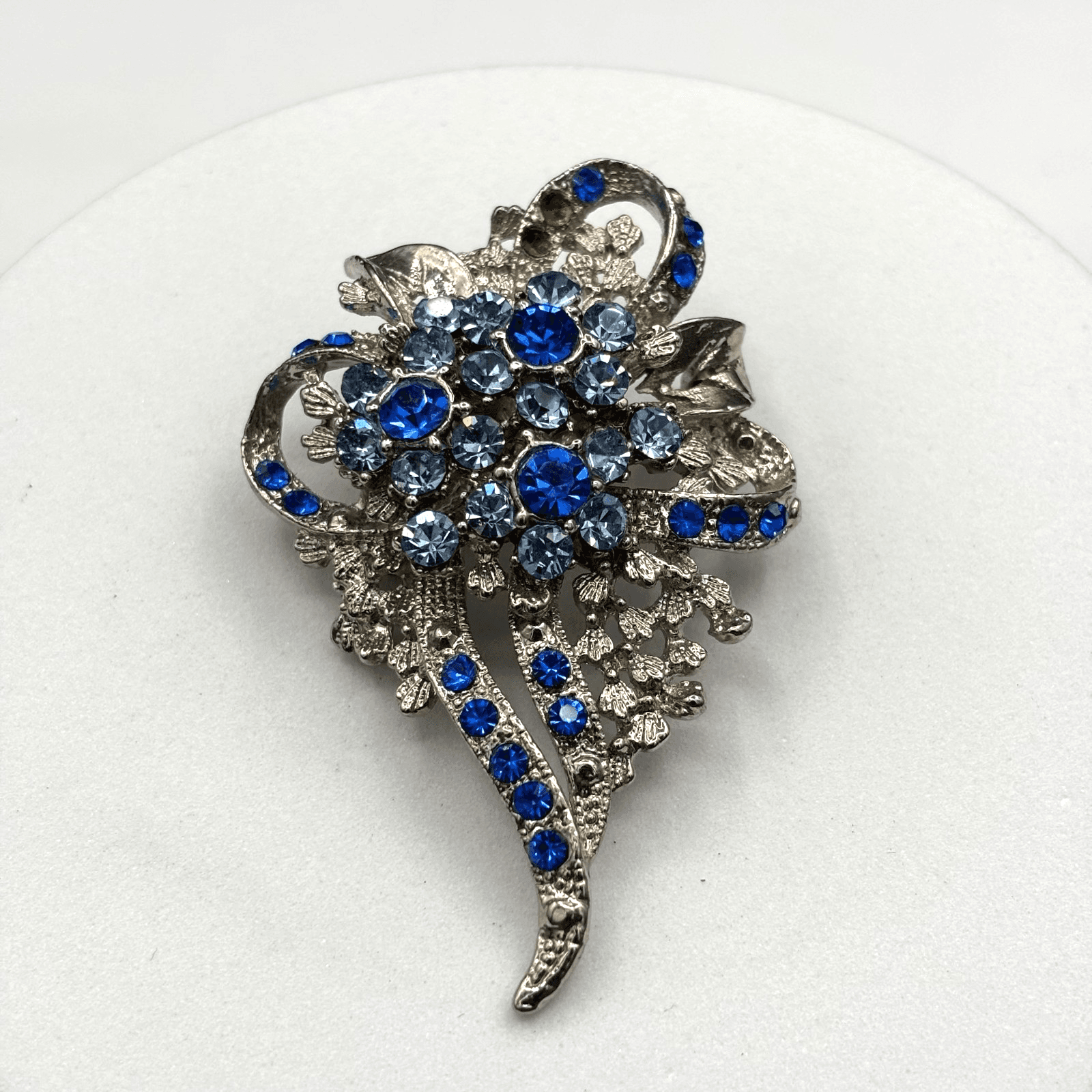 Silver-Tone Foilback Blue Rhinestone Floral Brooch Vintage Sparkle Style - Image 1