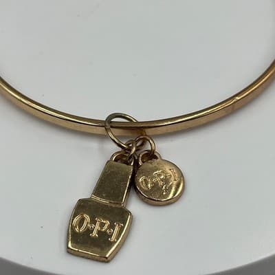 Vintage OPI Gold Tone Bangle Bracelet with Nail Polish Bottle & Logo Disc Charms - Thumbnail 3