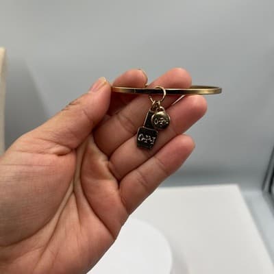 Vintage OPI Gold Tone Bangle Bracelet with Nail Polish Bottle & Logo Disc Charms - Thumbnail 6