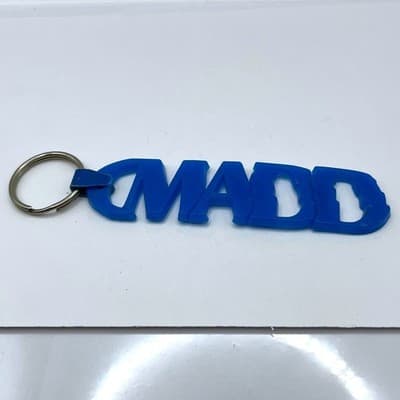 Vintage MADD Keychain Blue Rubber Mothers Against Drunk Driving Awareness Logo - Image 1