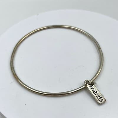 Vintage Silver Tone Bangle Bracelet with 'Friends' Charm, Minimalist Jewelry - Image 1