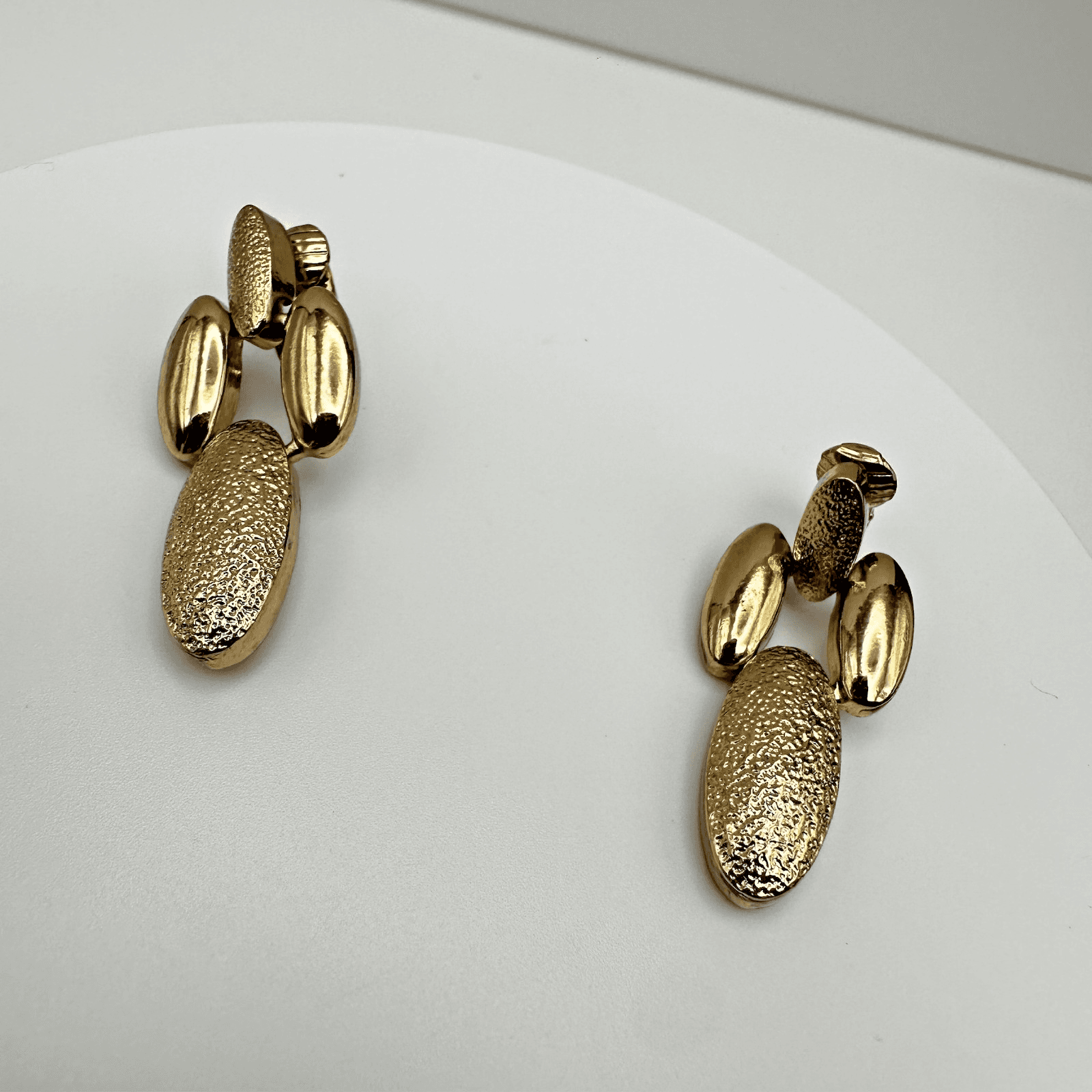 Vintage 80s 90s Gold Tone Textured Oval Drop Clip On Earrings Fashion Jewelry - Image 1