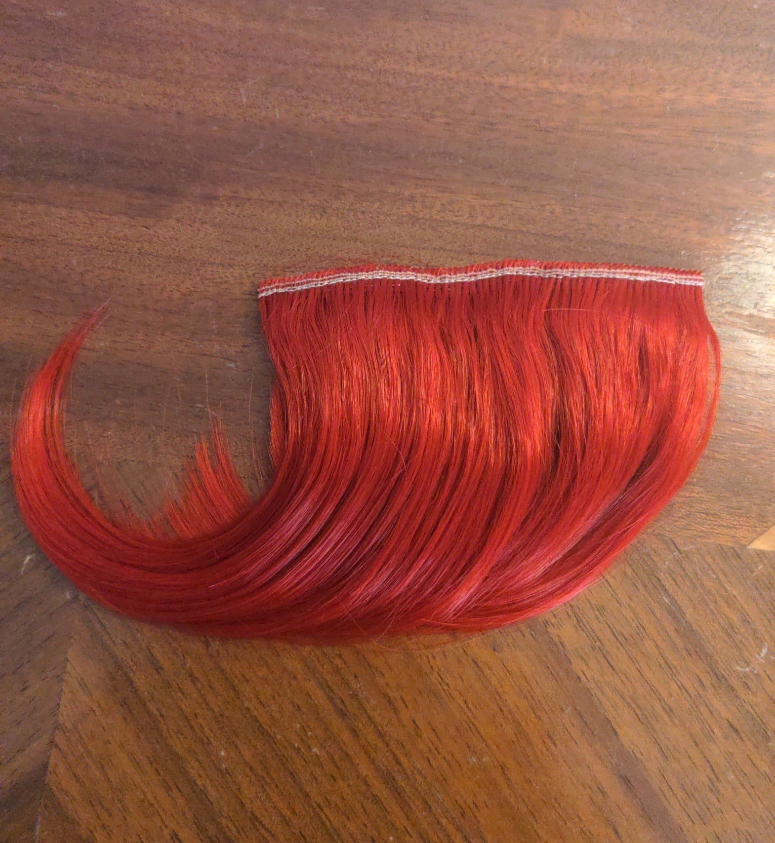 Red clip in bangs - Image 1