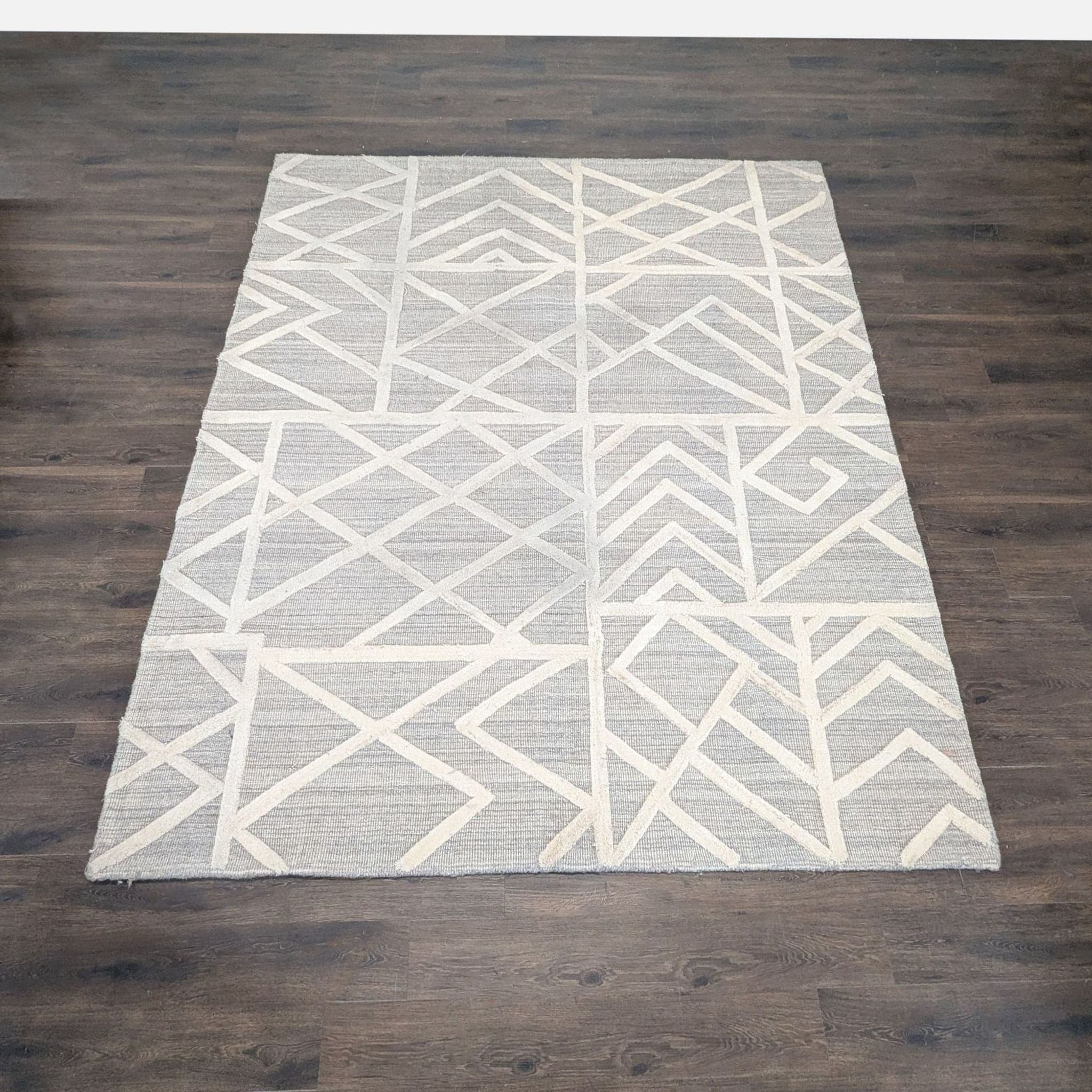 Signature Design by Ashley Modern Geometric Karah 8x10 Area Rug, Gray and Cream - Image 1