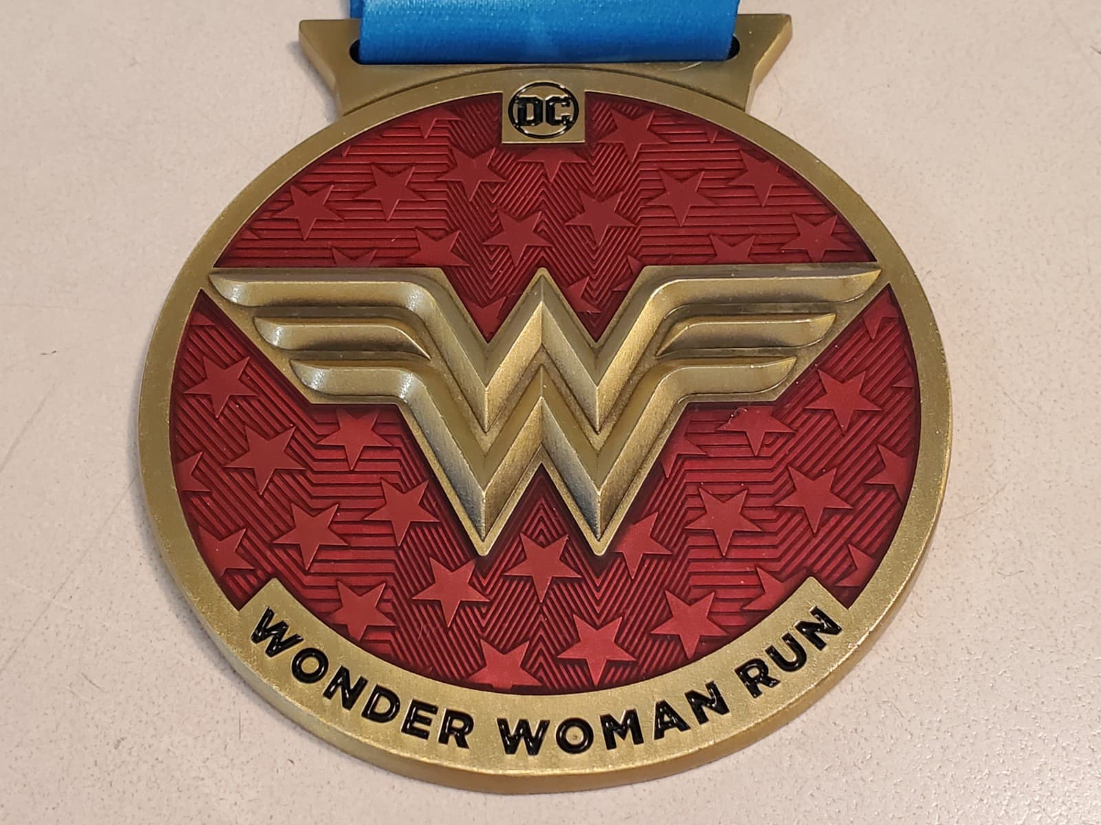 DC WONDER WOMAN RUN SERIES Medal with Ribbon. Bronze color metal w red enamel - Image 1