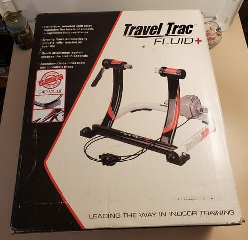 TRAVEL TRAC Fluid + Indoor Bike Trainer 40-0346. Progressive internal flywheel - Image 1