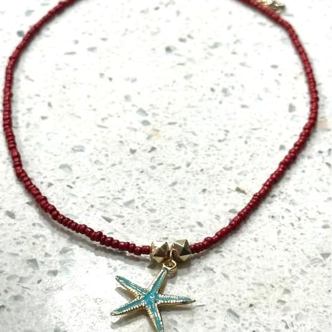 Elegant red beaded necklace featuring a charming starfish pendant. - Thumbnail 2