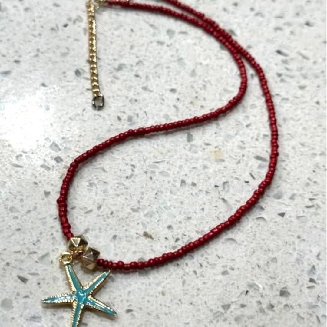 Elegant red beaded necklace featuring a charming starfish pendant. - Thumbnail 4
