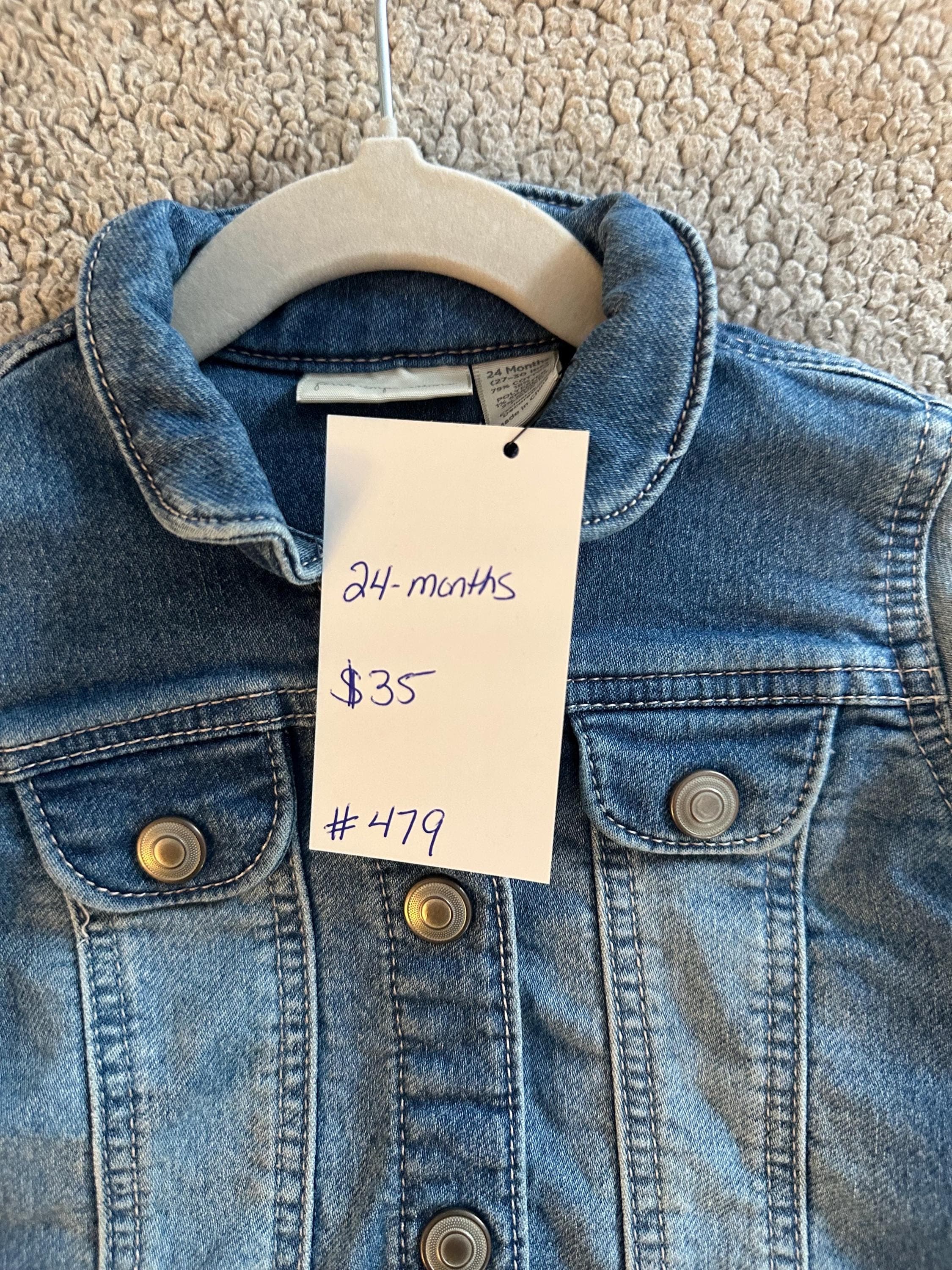 A loader and dump truck on back of denim jacket - Thumbnail 3