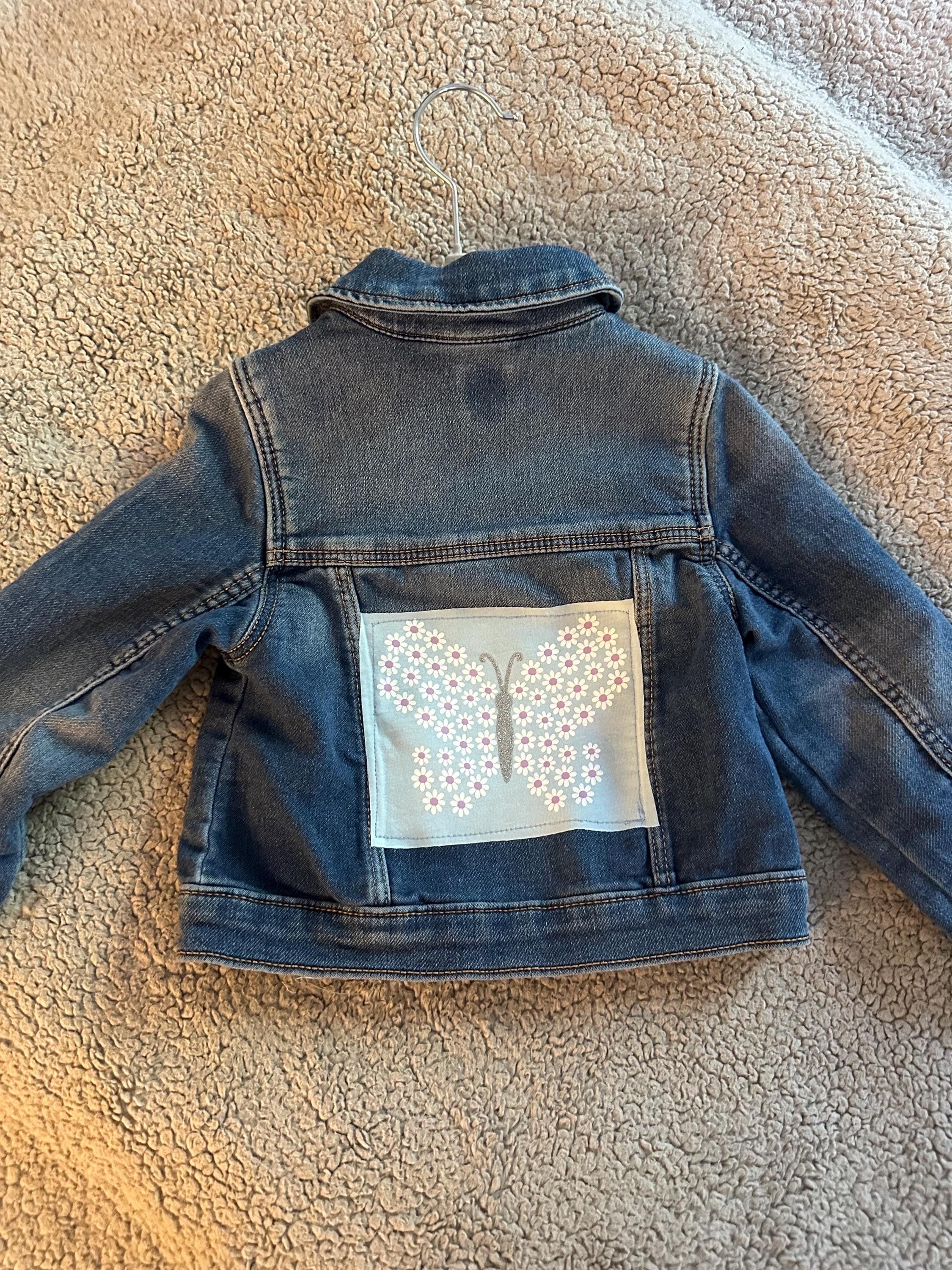 Denim jacket with butterfly on back - Image 1