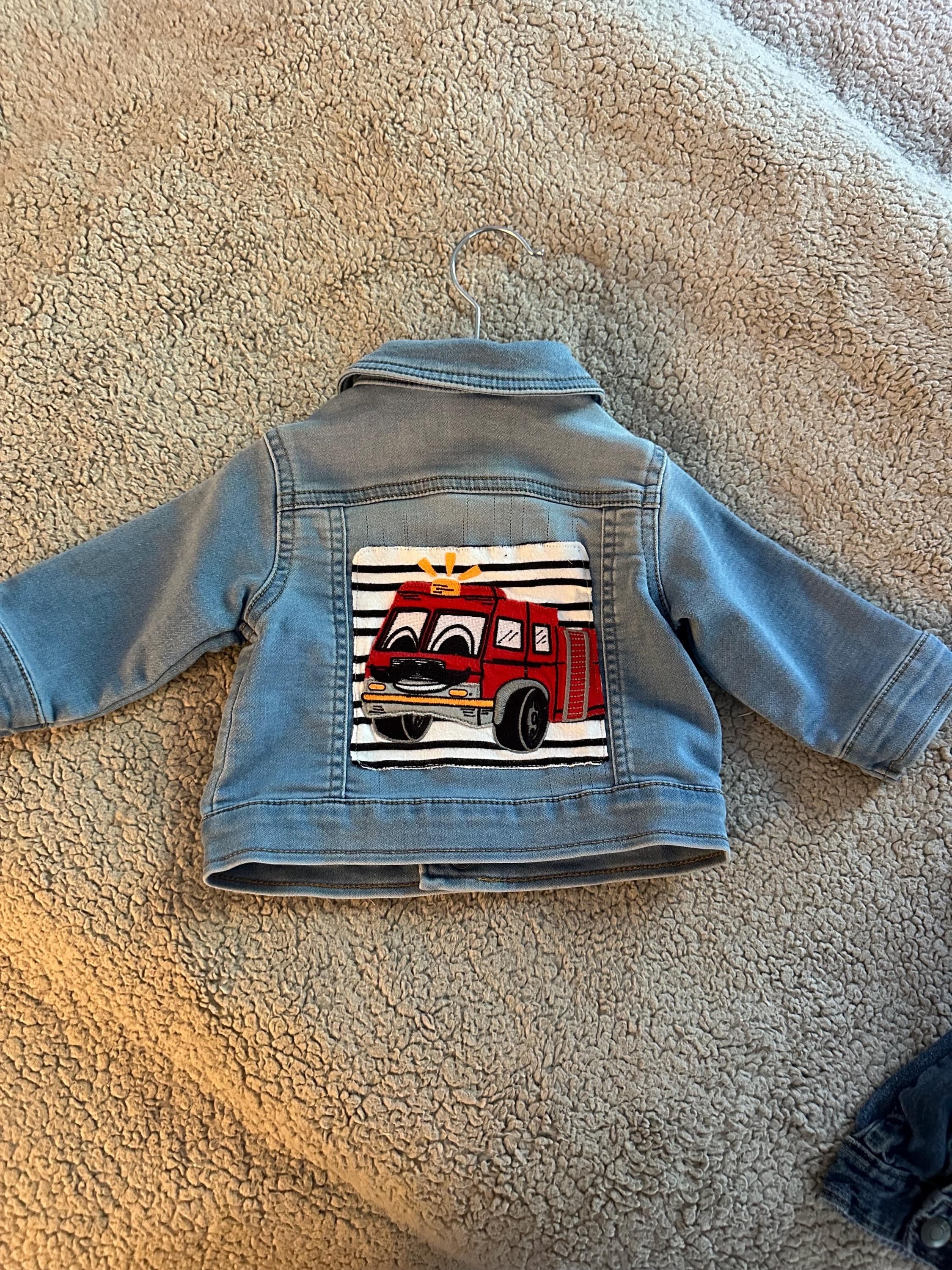 Denim jacket with fire truck on back - Image 1