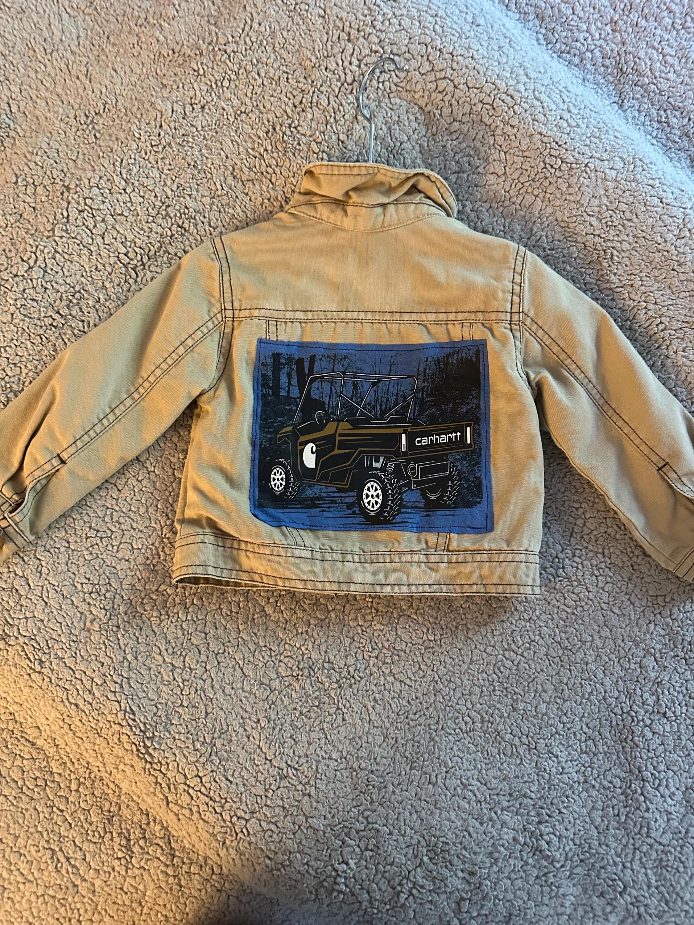 Khaki denim jacket with Carhartt truck on back - Image 1